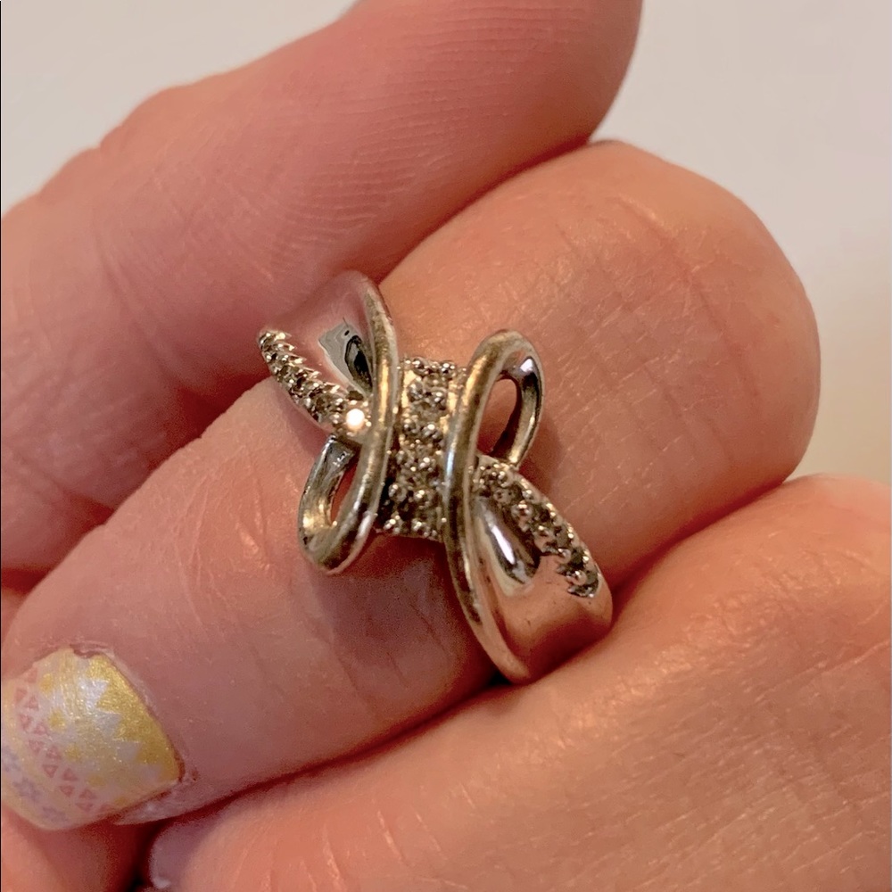 Sterling Silver Swirl ring with diamond accents.